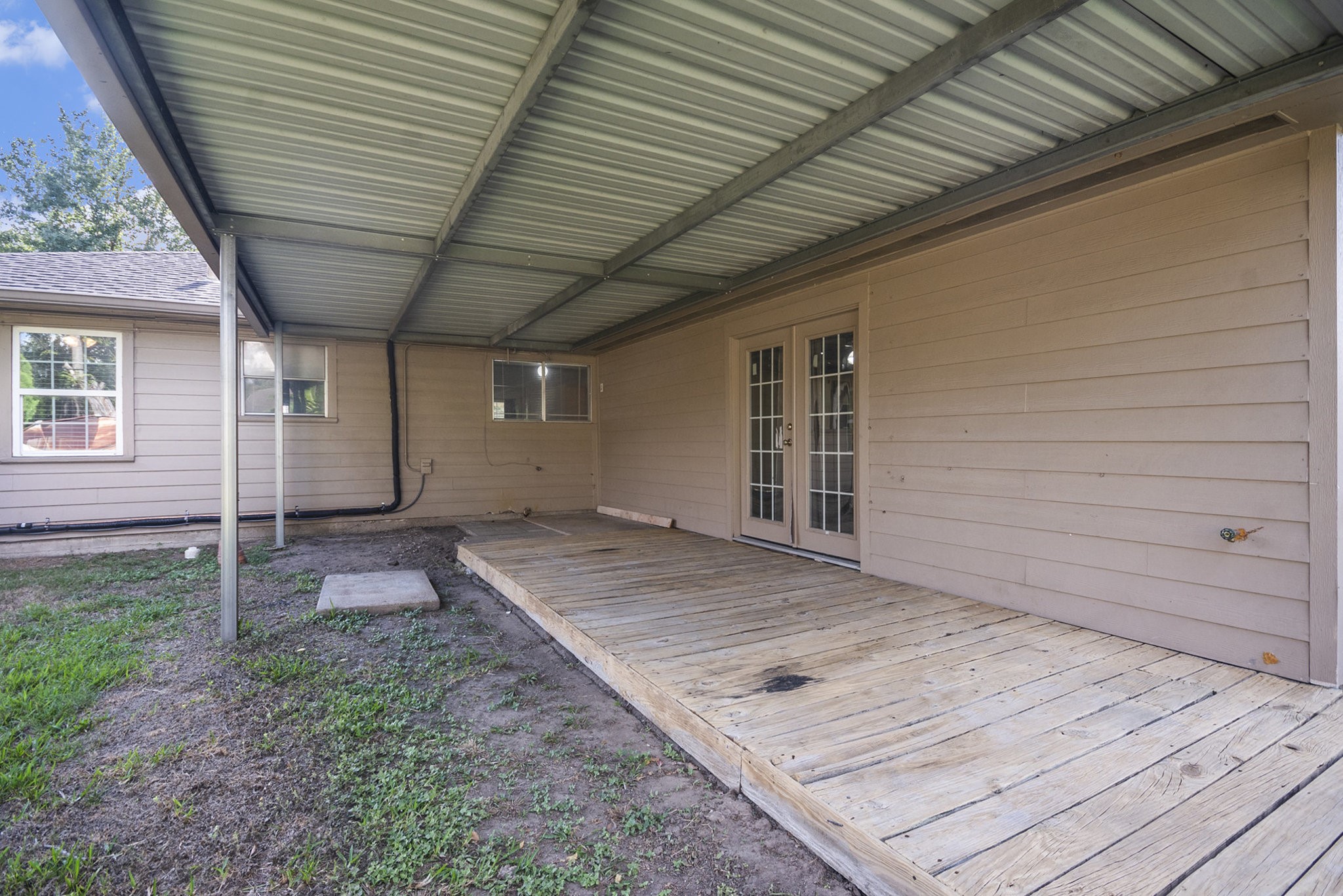 10619 Wheaton Drive Houston, TX 77089 - Photo 20 of 25 Enjoy outdoor living on this spacious covered patio, perfect for relaxation and entertaining.