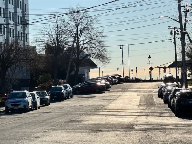 a view of a street with cars