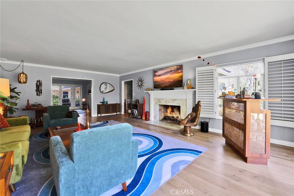 705 Chaucer Road San Marino, CA 91108 - Photo 13 of 35 a living room with furniture a fireplace and a flat screen tv