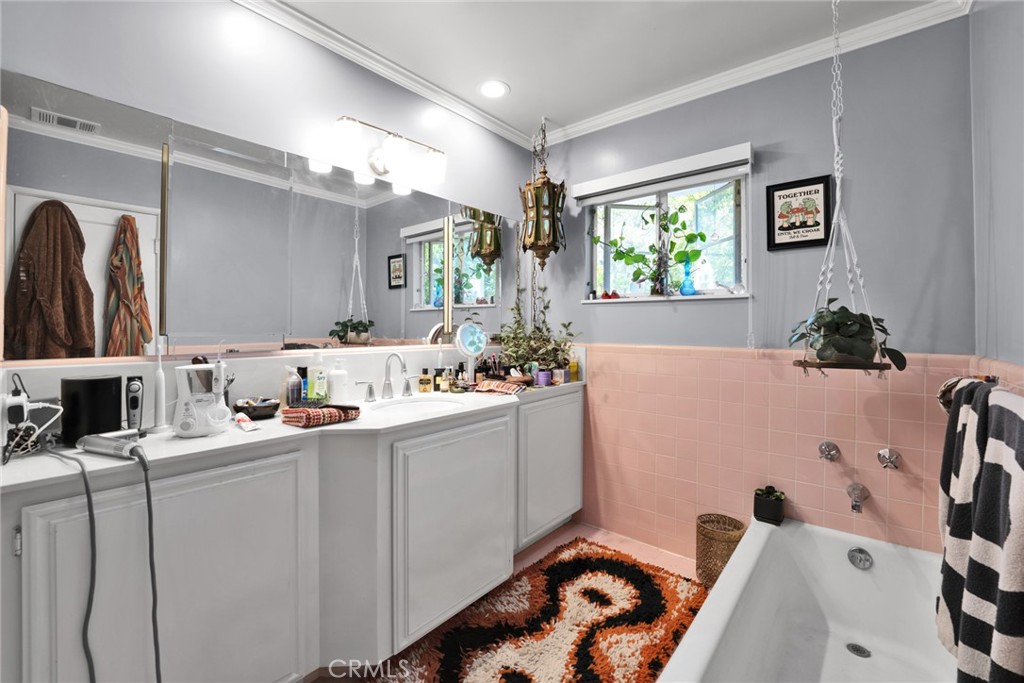705 Chaucer Road San Marino, CA 91108 - Photo 18 of 35 a bathroom with a sink mirror and window