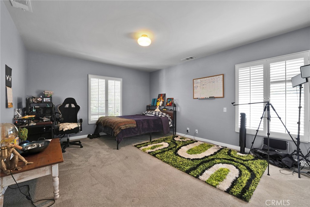 705 Chaucer Road San Marino, CA 91108 - Photo 20 of 35 a bedroom with furniture and a window