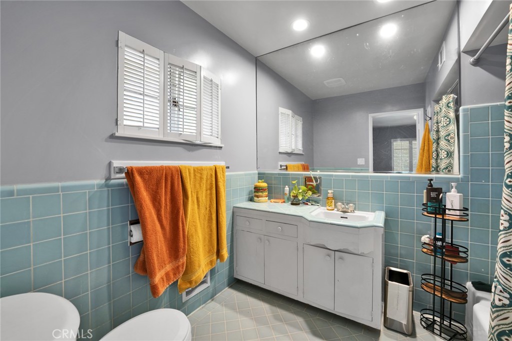 705 Chaucer Road San Marino, CA 91108 - Photo 21 of 35 a bathroom with a sink mirror and toilet
