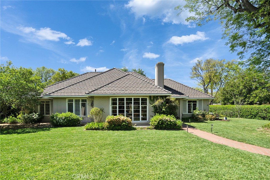 705 Chaucer Road San Marino, CA 91108 - Photo 26 of 35 a front view of a house with a garden
