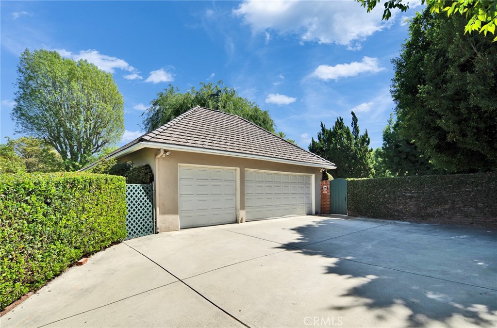 705 Chaucer Road San Marino, CA 91108 - Photo 27 of 35 a front view of a house with a yard and garage