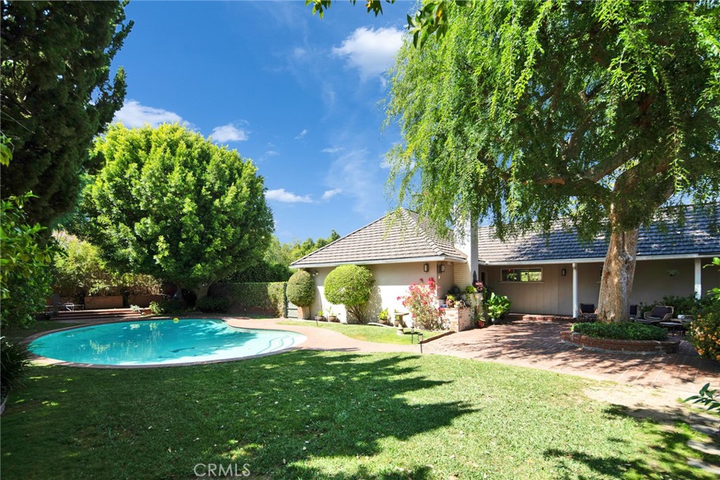 705 Chaucer Road San Marino, CA 91108 - Photo 29 of 35 a view of a house with a yard patio and a tree