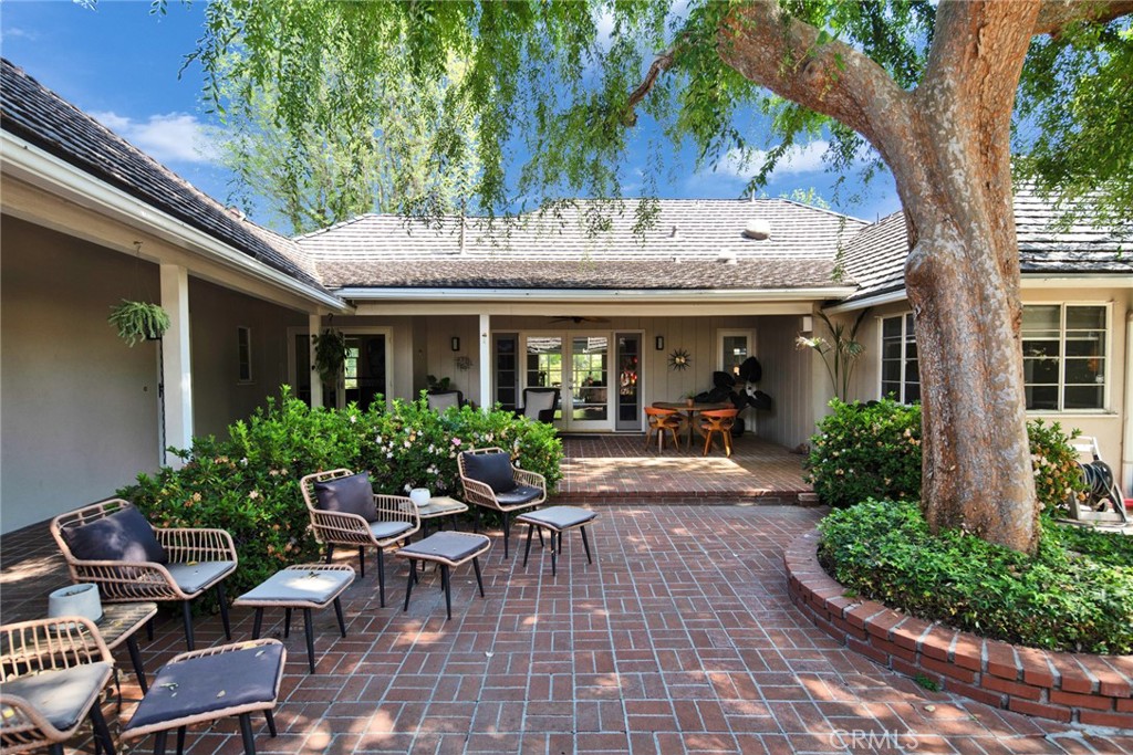 705 Chaucer Road San Marino, CA 91108 - Photo 31 of 35 a view of a house with sitting area and garden