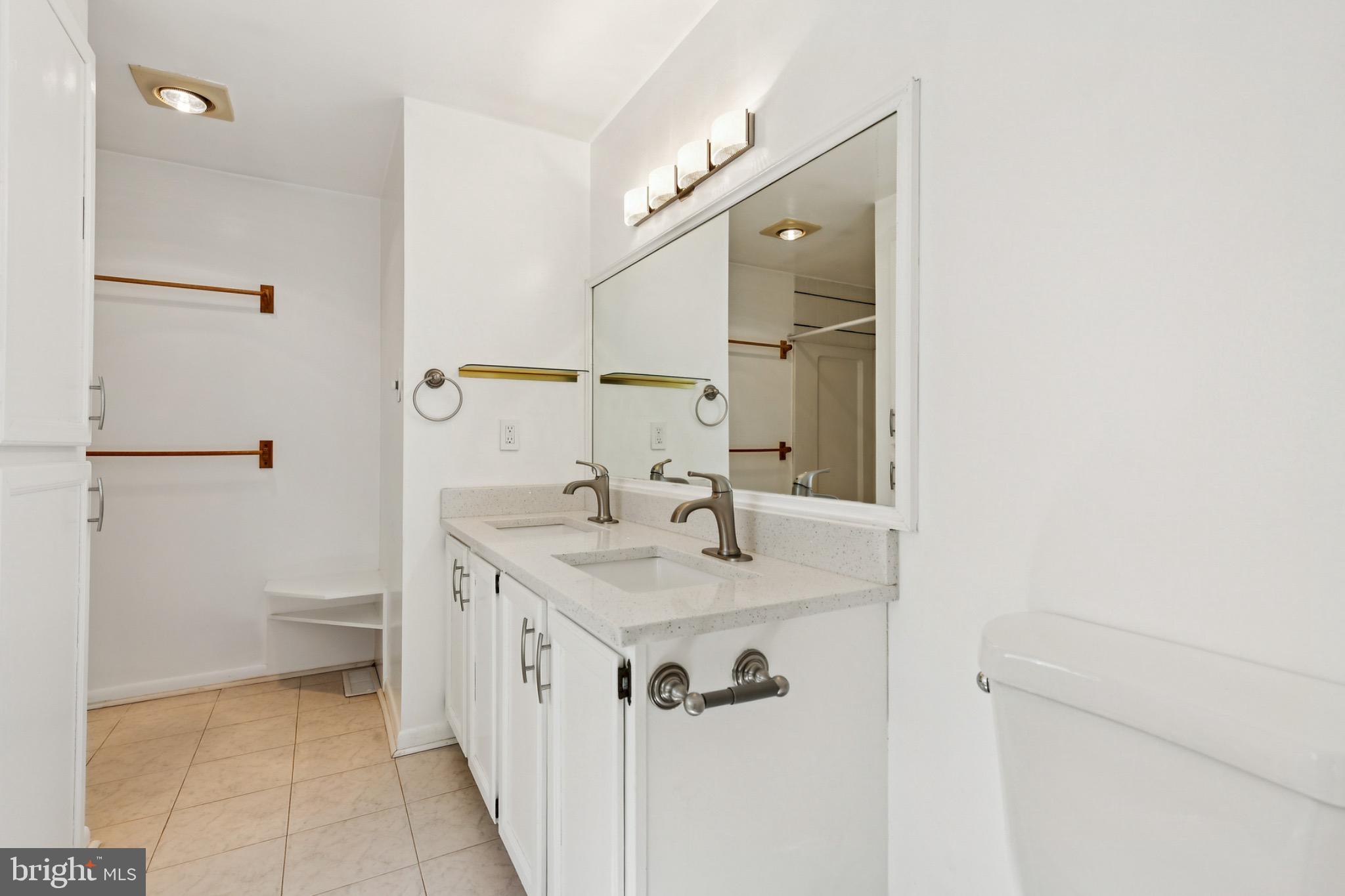 6127 Beverleys Mill Road Broad Run, VA 20137 - Photo 16 of 28 Primary bath with dual sinks and walk in shower.