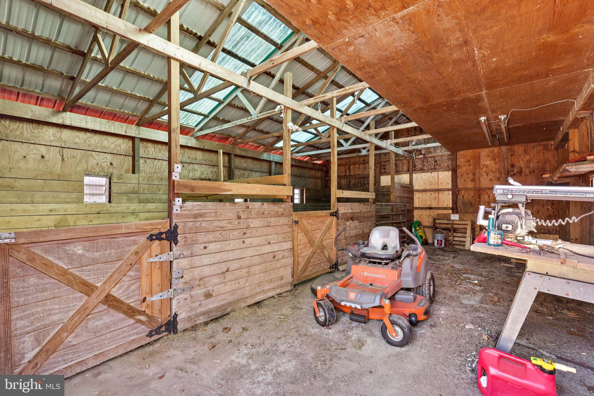6127 Beverleys Mill Road Broad Run, VA 20137 - Photo 25 of 28 Interior of spacious barn with two stalls.
