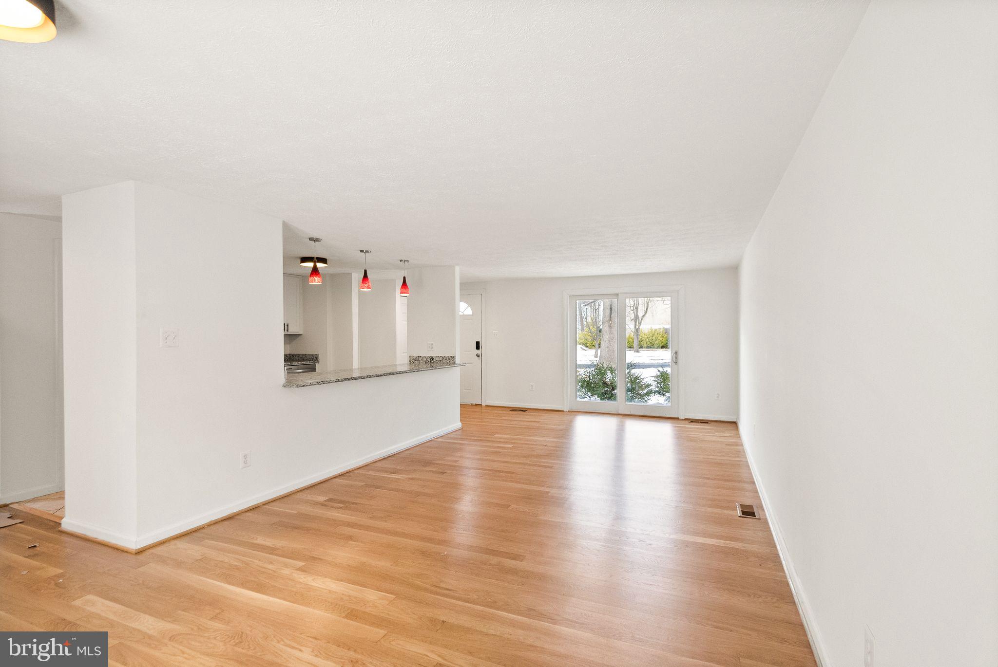 2280 Cocquina Drive Reston, VA 20191 - Photo 14 of 66 a view of an empty room with wooden floor and a window