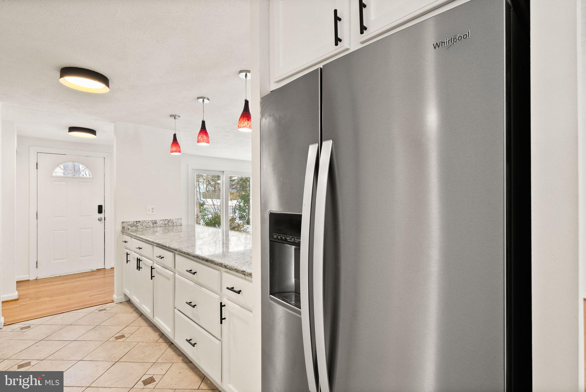 2280 Cocquina Drive Reston, VA 20191 - Photo 17 of 66 a kitchen with granite countertop a refrigerator and a sink