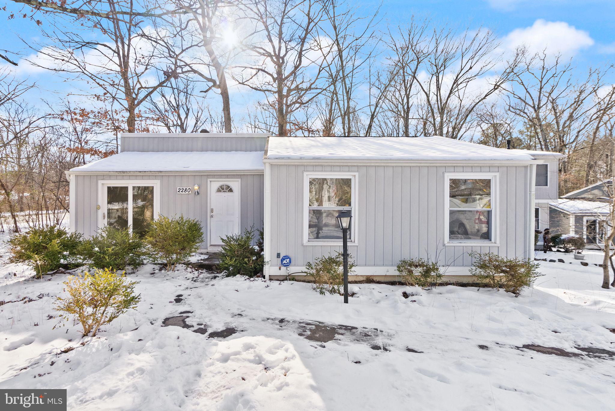 2280 Cocquina Drive Reston, VA 20191 - Photo 2 of 66 a front view of a house with a yard