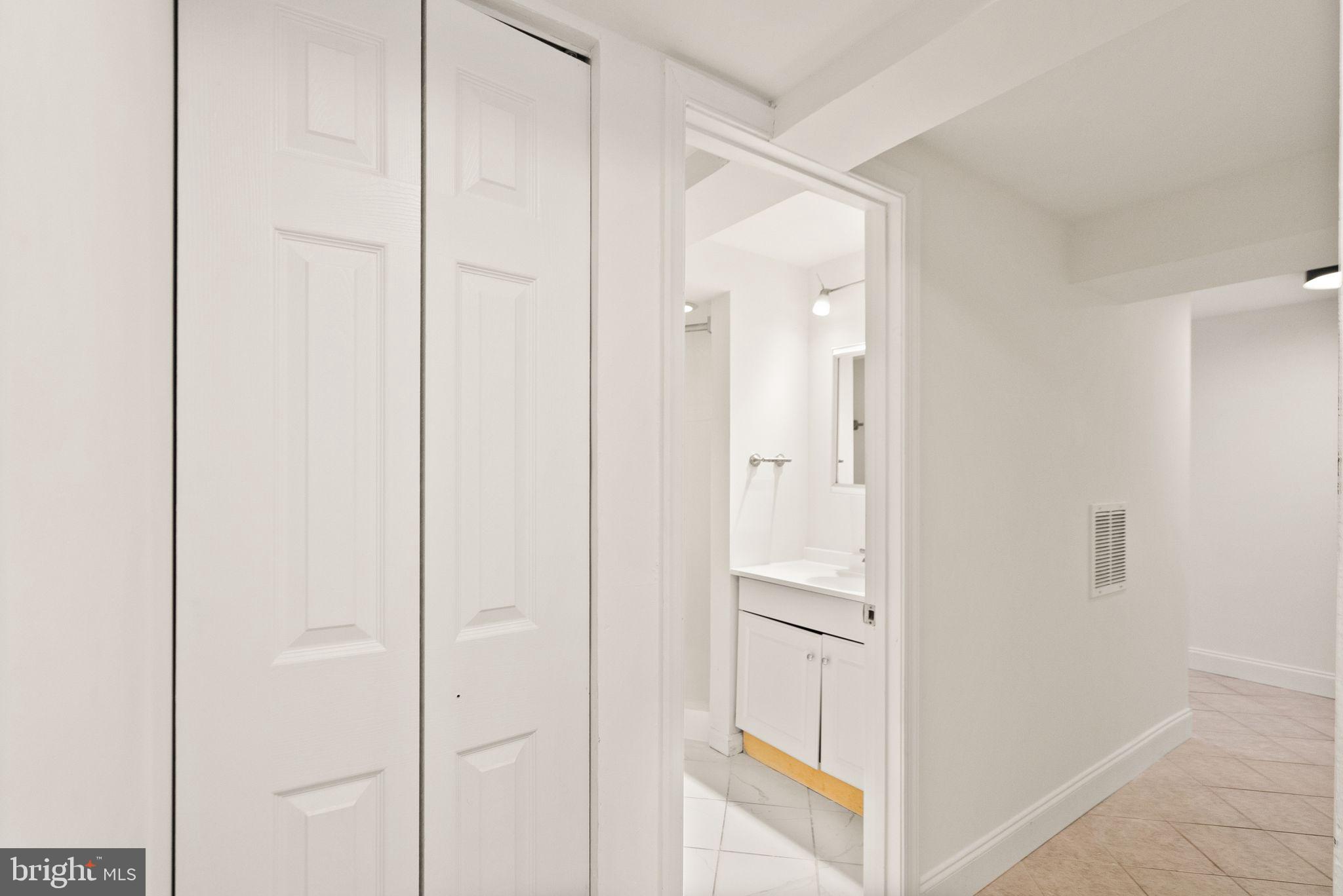 2280 Cocquina Drive Reston, VA 20191 - Photo 51 of 66 a bathroom with a shower and a glass door
