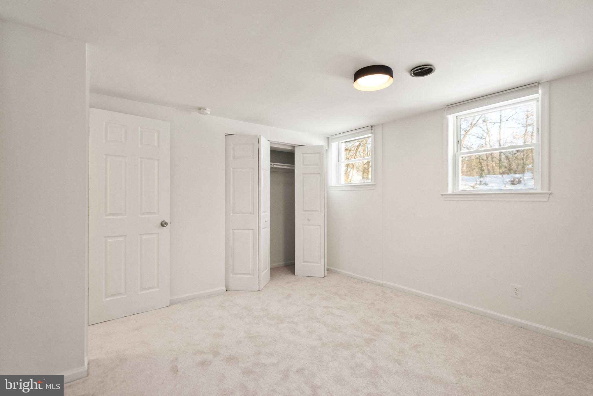 2280 Cocquina Drive Reston, VA 20191 - Photo 54 of 66 an empty room with windows and closet