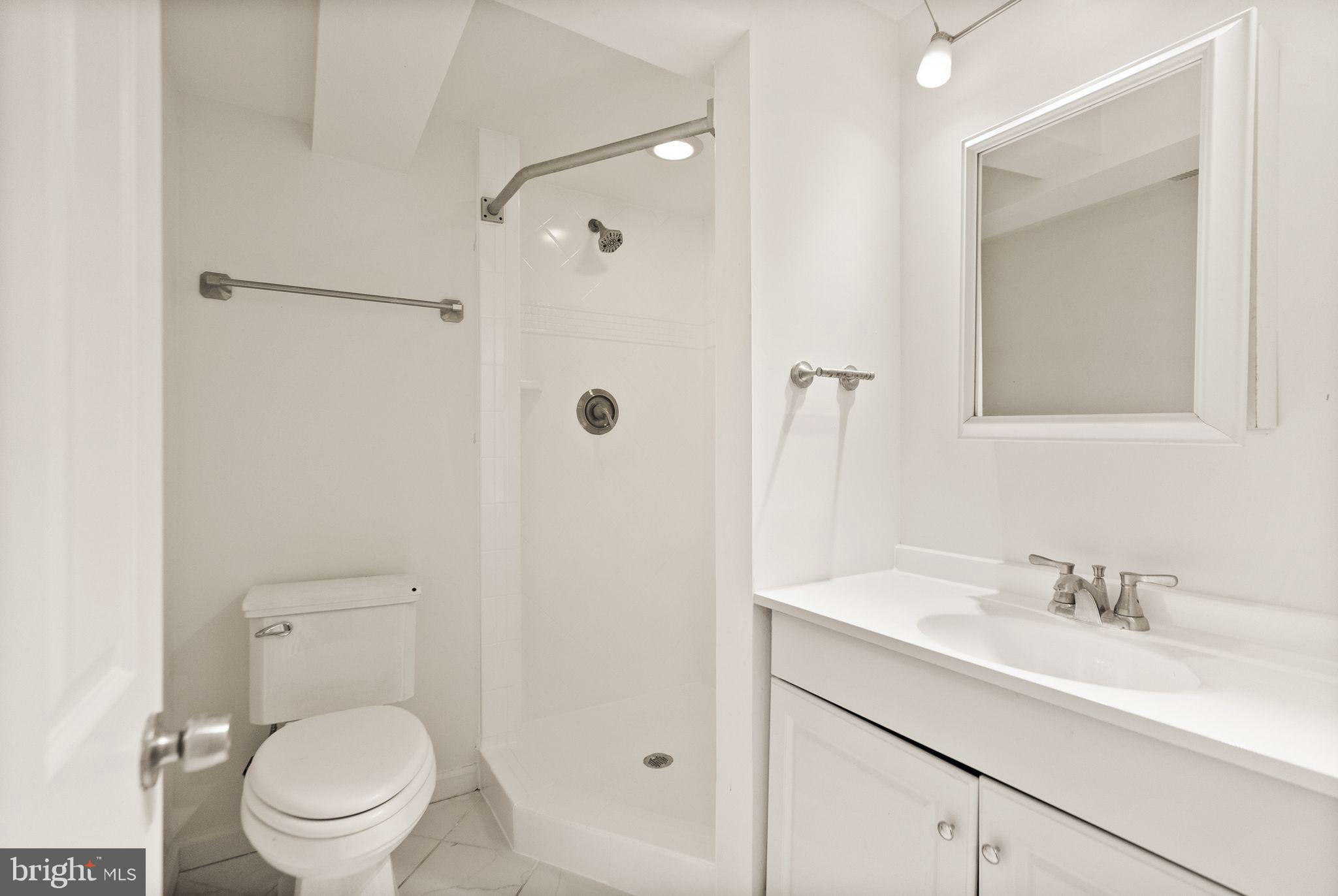 2280 Cocquina Drive Reston, VA 20191 - Photo 55 of 66 a bathroom with a sink toilet and shower