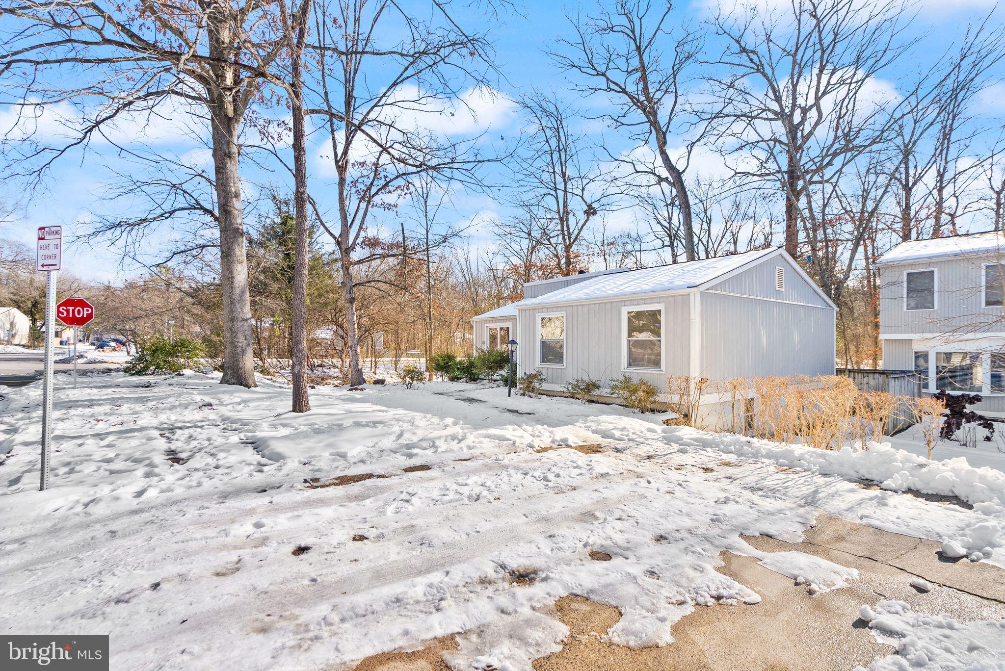 2280 Cocquina Drive Reston, VA 20191 - Photo 6 of 66 a view of a house with a yard covered in snow