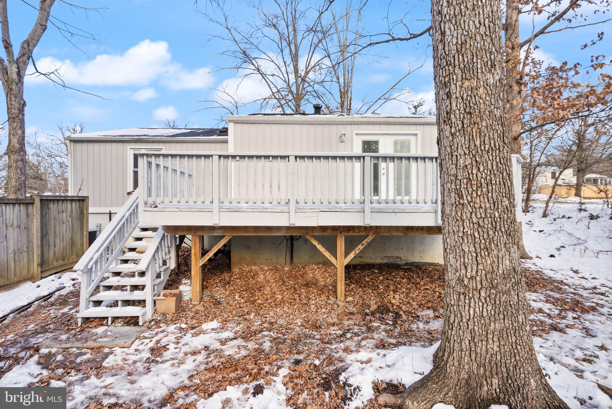 2280 Cocquina Drive Reston, VA 20191 - Photo 64 of 66 a view of a roof deck with wooden fence and floor