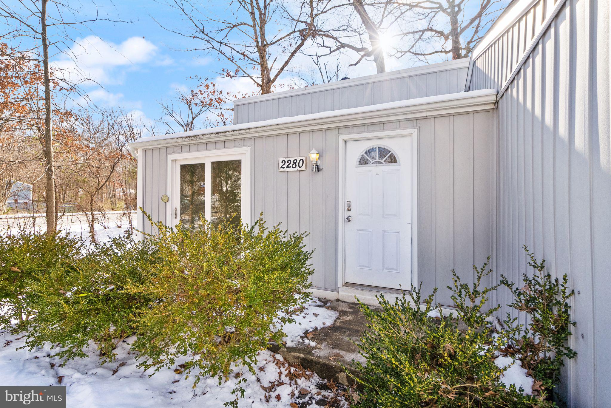 2280 Cocquina Drive Reston, VA 20191 - Photo 8 of 66 a front view of a house with garden