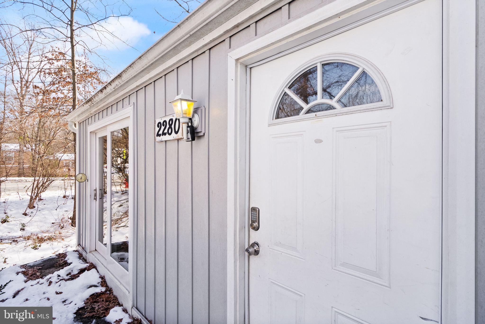 2280 Cocquina Drive Reston, VA 20191 - Photo 10 of 66 a front view of a house with parking