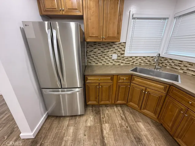 a kitchen with a refrigerator a sink and dishwasher