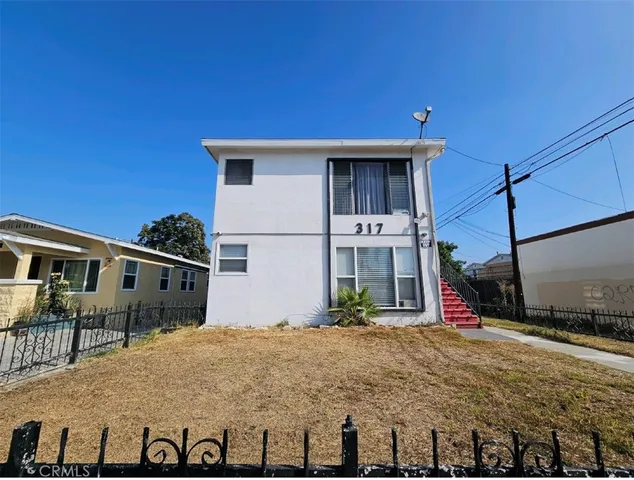 a front view of a house with a porch