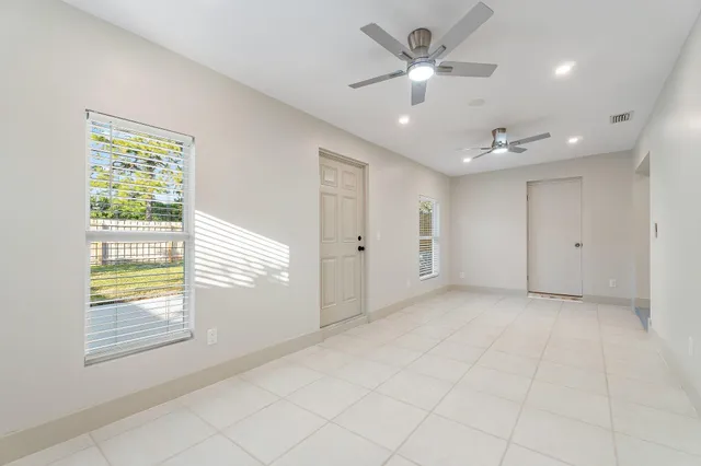 a view of an empty room with a window