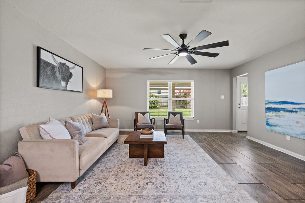 217 Farmer Lane Jarrell, TX 76537 - Photo 10 of 29 A welcoming living area boasts durable flooring and ample space for relaxation.