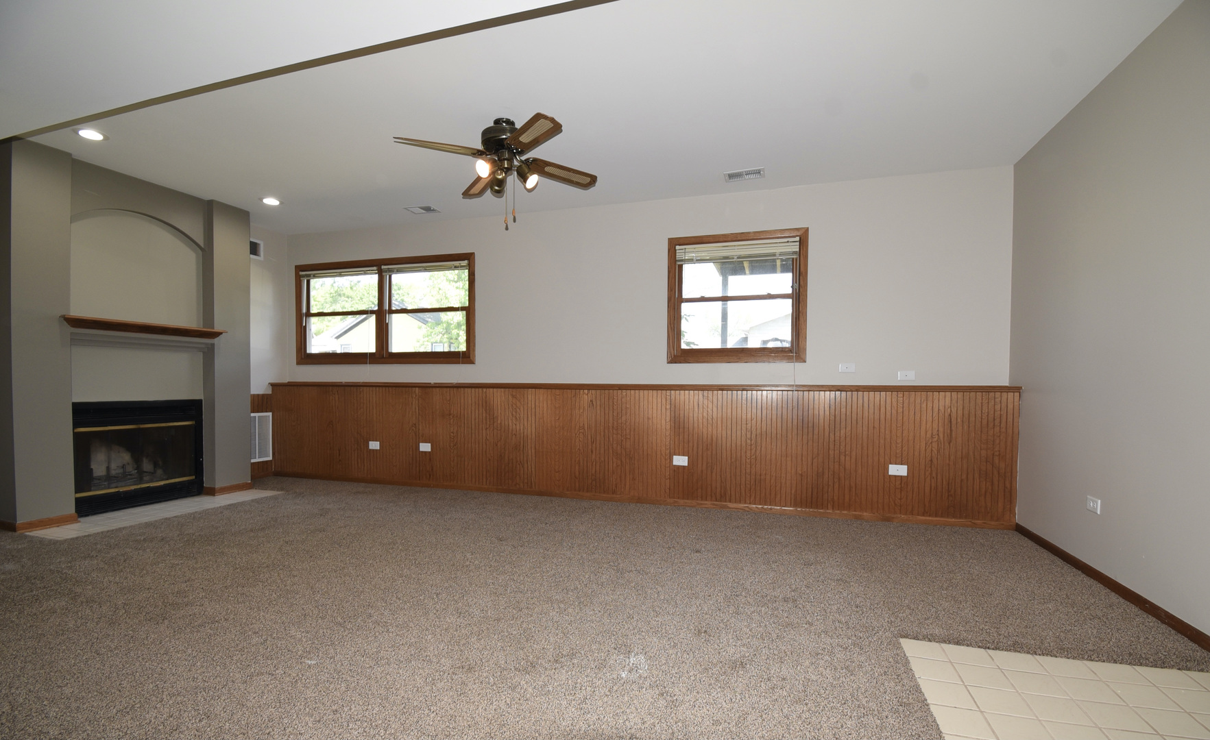 406 Garfield Road Fox Lake, IL 60041 - Photo 20 of 33 a view of an empty room with window and fireplace