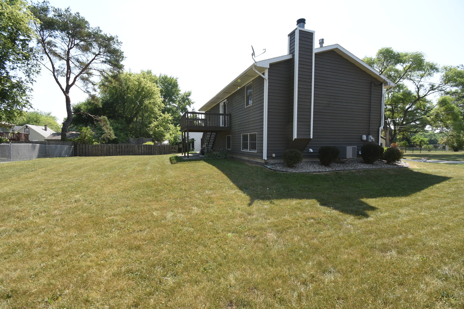 406 Garfield Road Fox Lake, IL 60041 - Photo 30 of 33 a view of a backyard with a large tree