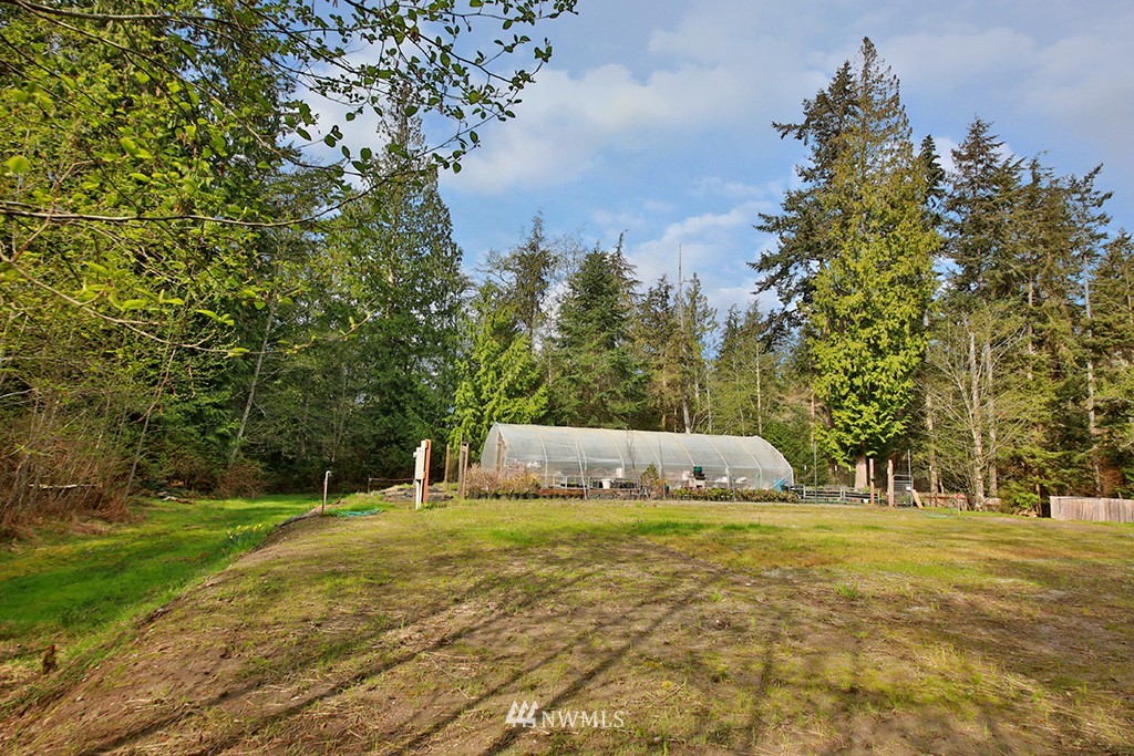 3731 East Harbor Road Langley, WA 98260 - Photo 3 of 21 a garden view with trees