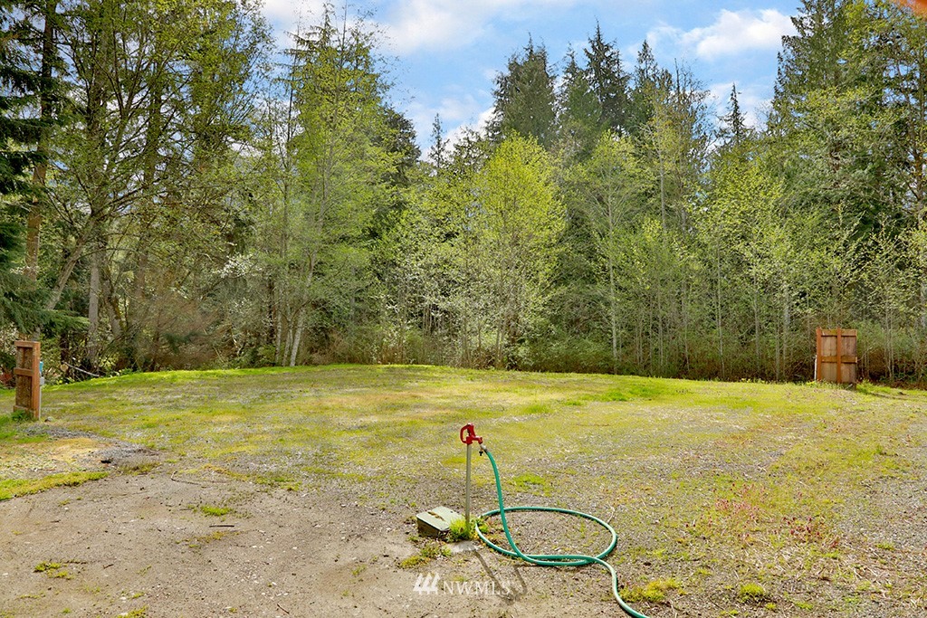 3731 East Harbor Road Langley, WA 98260 - Photo 4 of 21 a swimming pool with some trees in the background