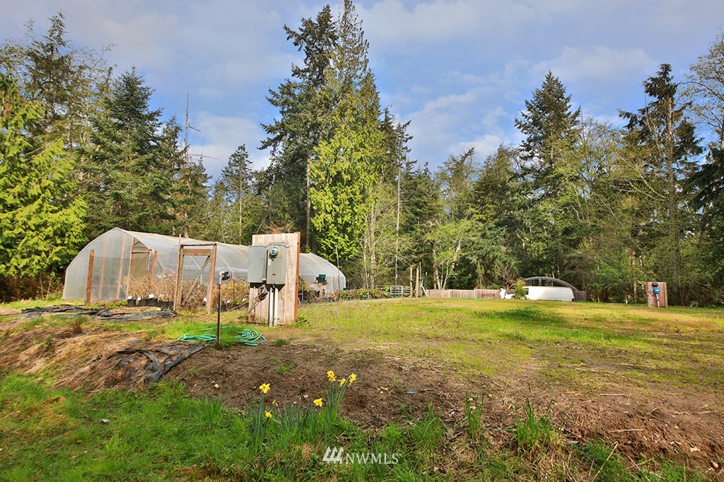 3731 East Harbor Road Langley, WA 98260 - Photo 6 of 21 a backyard of a house with table and chairs