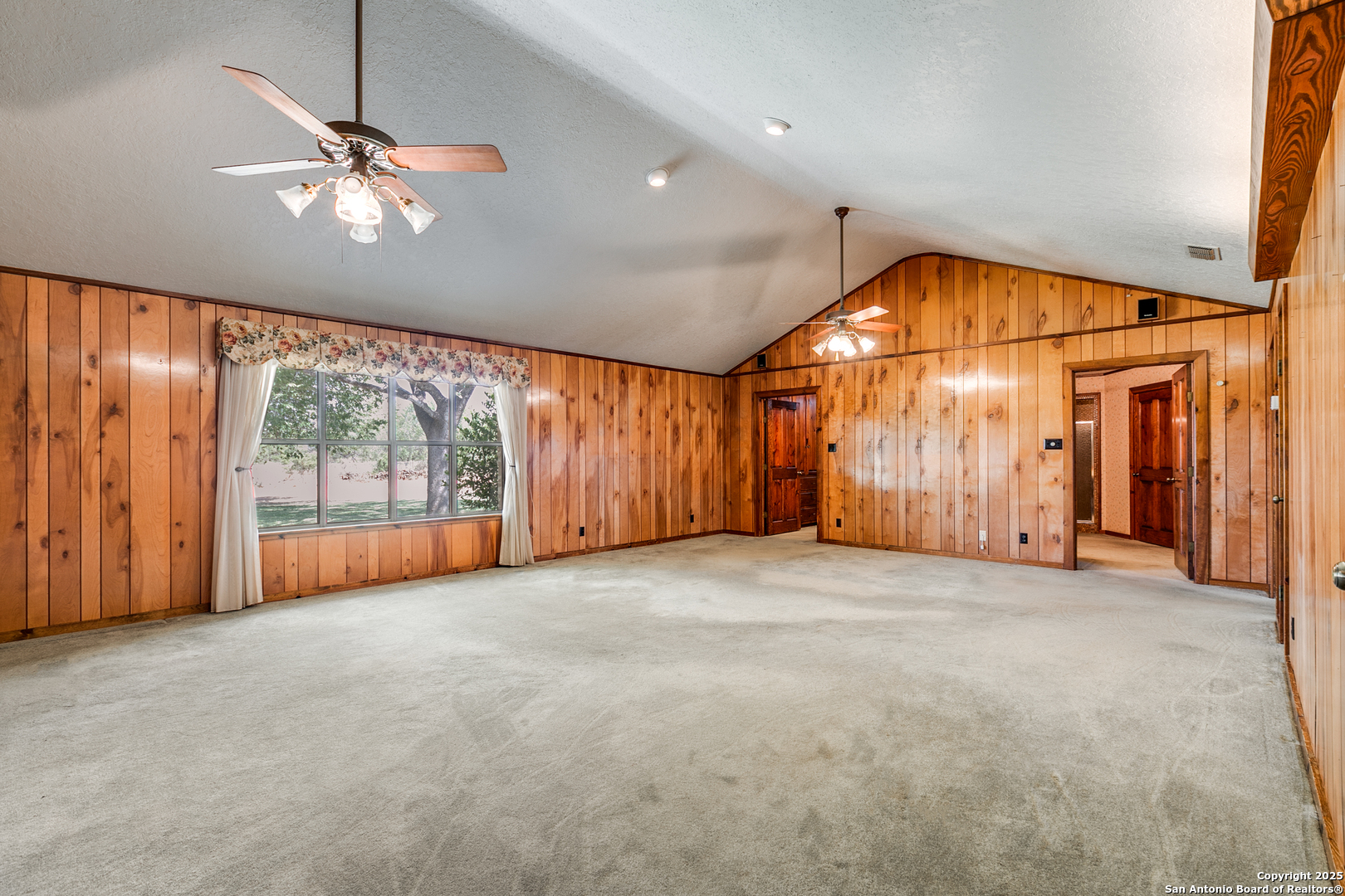 707 Berry Ranch Road Pearsall, TX 78061 - Photo 14 of 40 a view of empty room with a ceiling fan