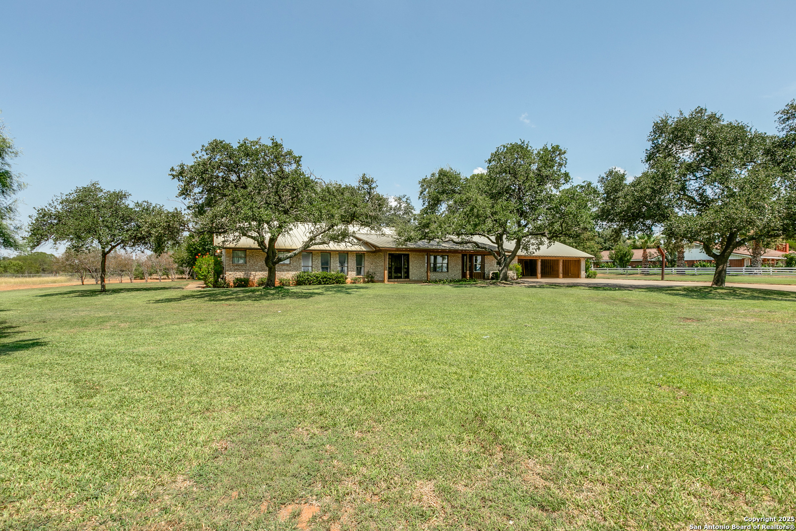 707 Berry Ranch Road Pearsall, TX 78061 - Photo 2 of 40 a front view of a house with a yard