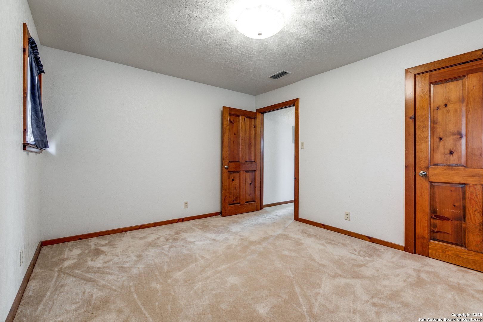 707 Berry Ranch Road Pearsall, TX 78061 - Photo 23 of 40 a view of an empty room