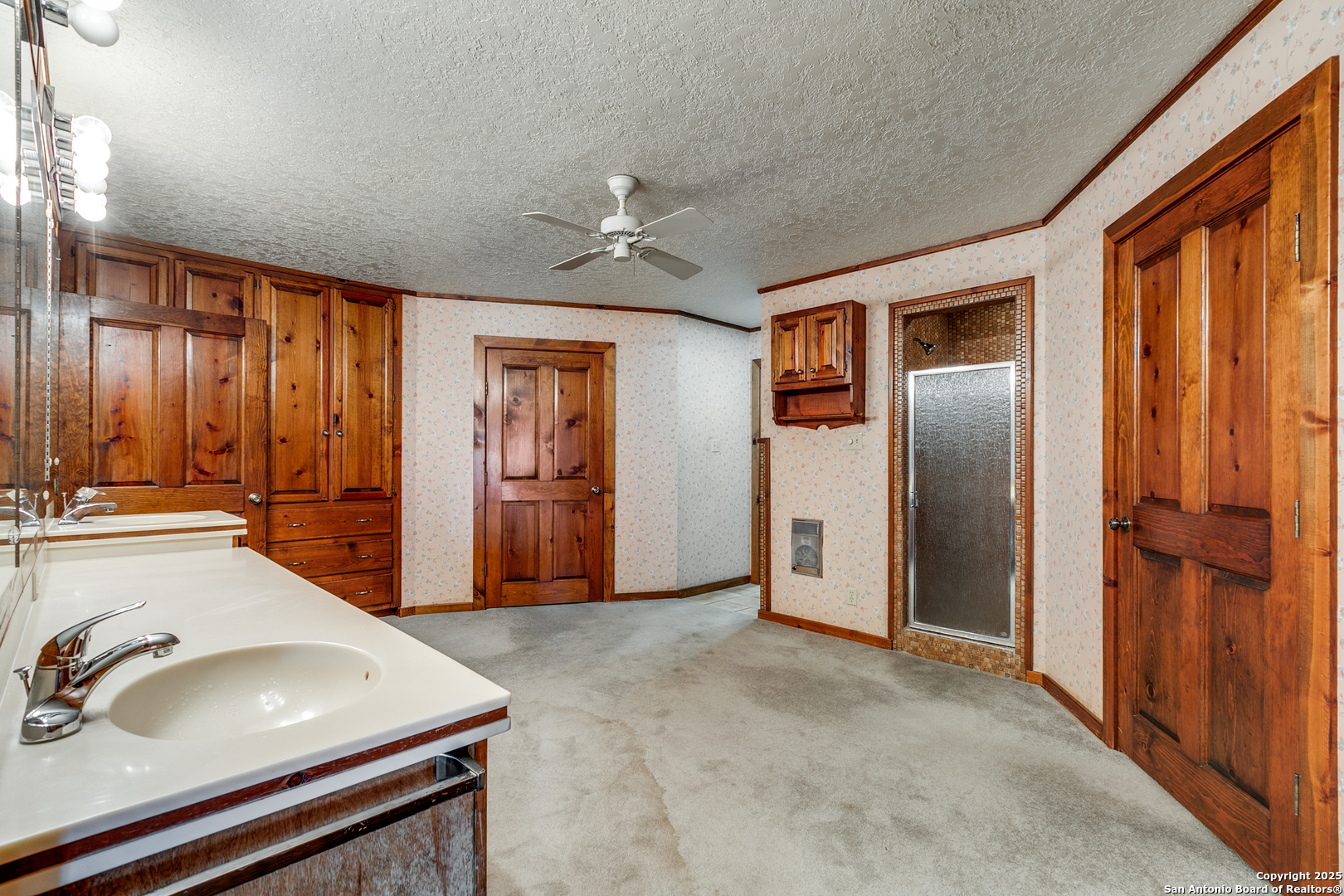 707 Berry Ranch Road Pearsall, TX 78061 - Photo 24 of 40 a bathroom with a sink a toilet and shower