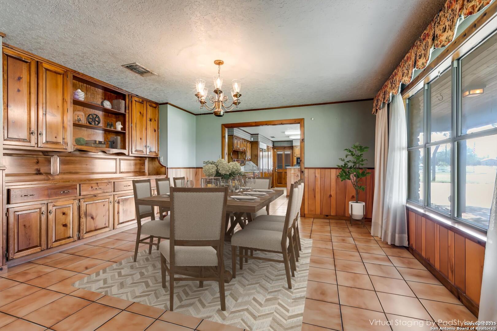 707 Berry Ranch Road Pearsall, TX 78061 - Photo 33 of 40 a view of a dining room with furniture
