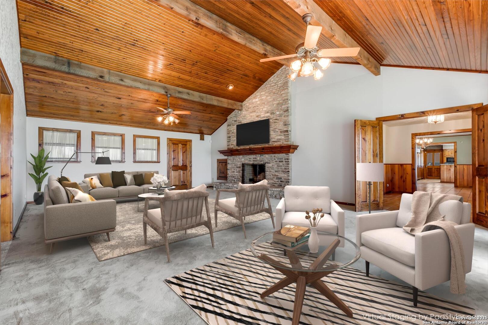 707 Berry Ranch Road Pearsall, TX 78061 - Photo 34 of 40 a living room with furniture a fireplace and a wooden floor
