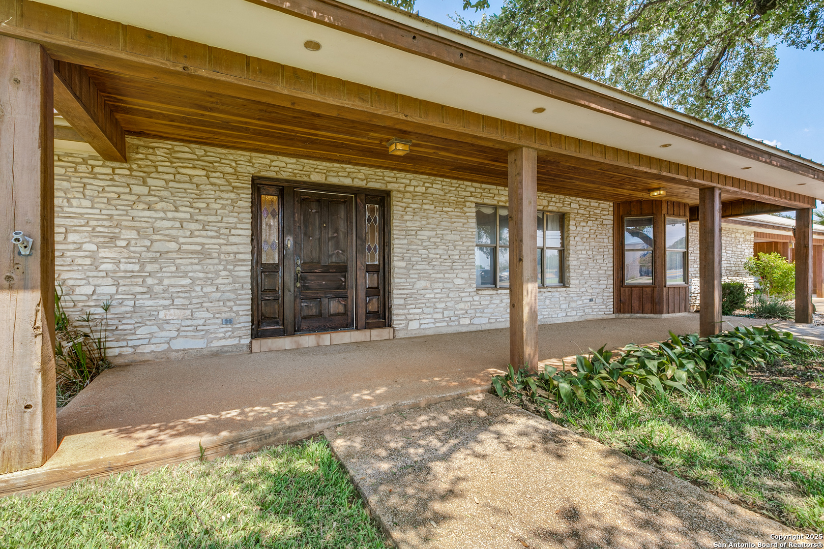 707 Berry Ranch Road Pearsall, TX 78061 - Photo 5 of 40 a front view of a house with a yard