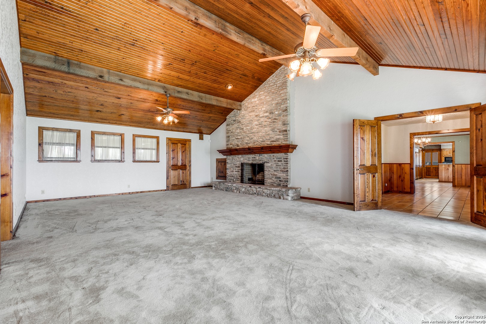 707 Berry Ranch Road Pearsall, TX 78061 - Photo 10 of 40 a view of an empty room with a fireplace