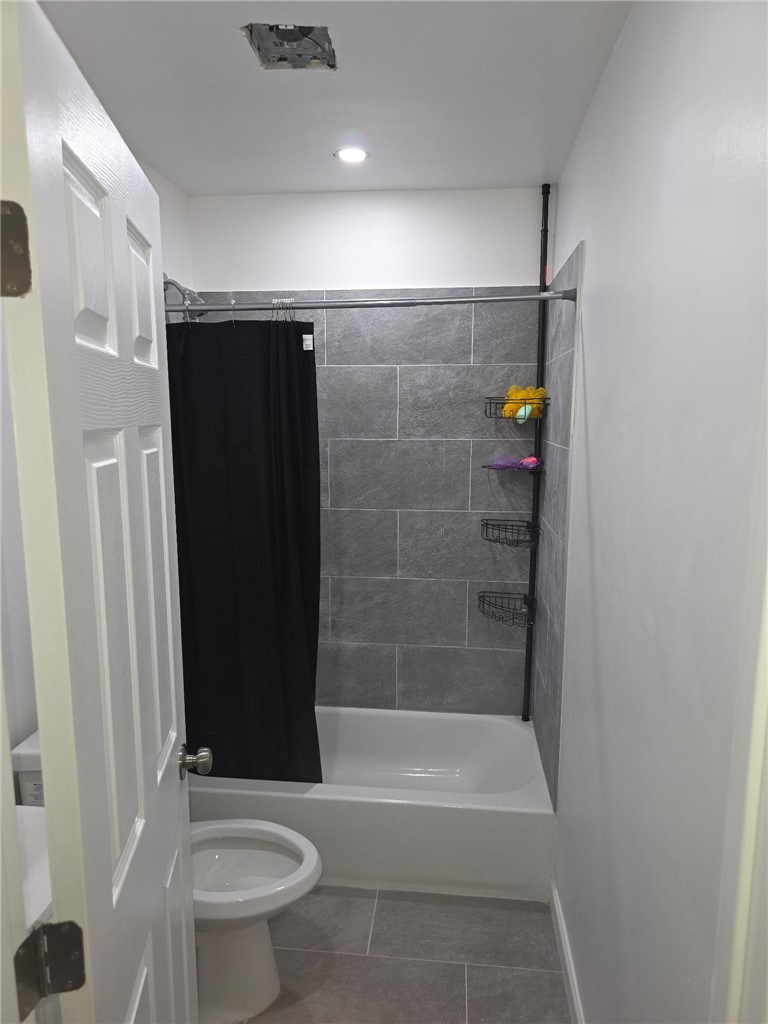 512 E Street Needles, CA 92363 - Photo 19 of 20 a bathroom with a shower and a toilet