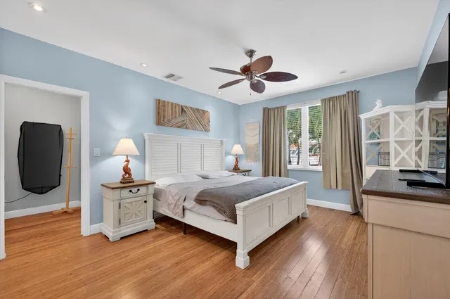 a bedroom with bed and window