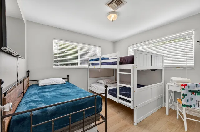 a bathroom with a toilet a sink and a mirror