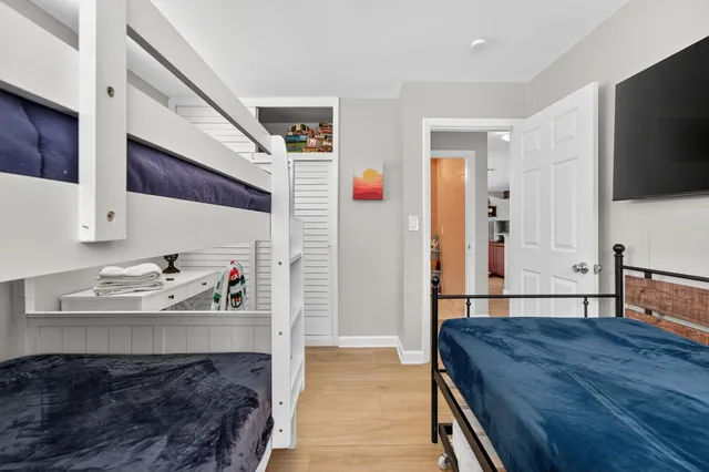 a bathroom with a sink a toilet and shower curtain