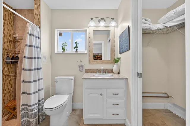 a view of a patio with a table chairs and a swimming pool