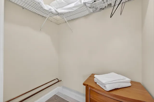 a dining room with wooden floor and furniture
