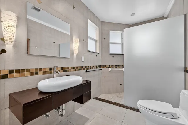 a view of a backyard with sitting area