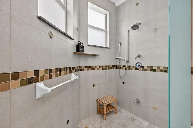 a view of a house with swimming pool and sitting area