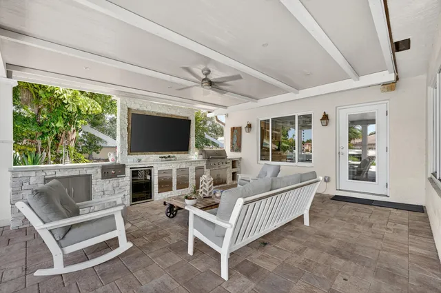 a view of a chairs and table in patio
