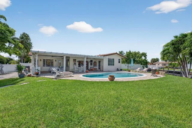 a view of a swimming pool with a patio