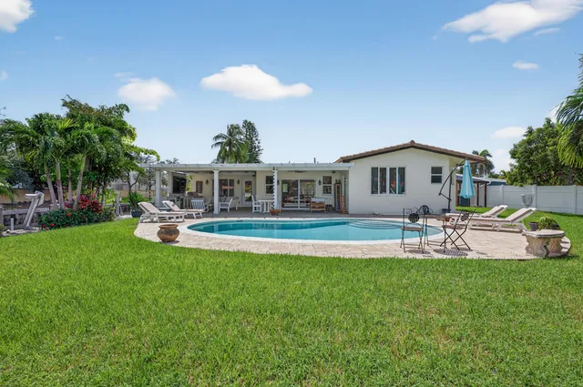 a view of a balcony with an outdoor space and seating area